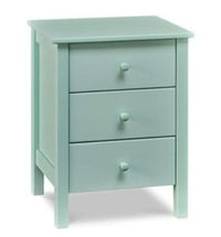 A light blue three drawer nightstand
